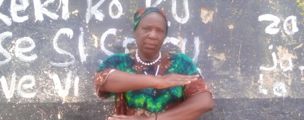 A woman signals for equality